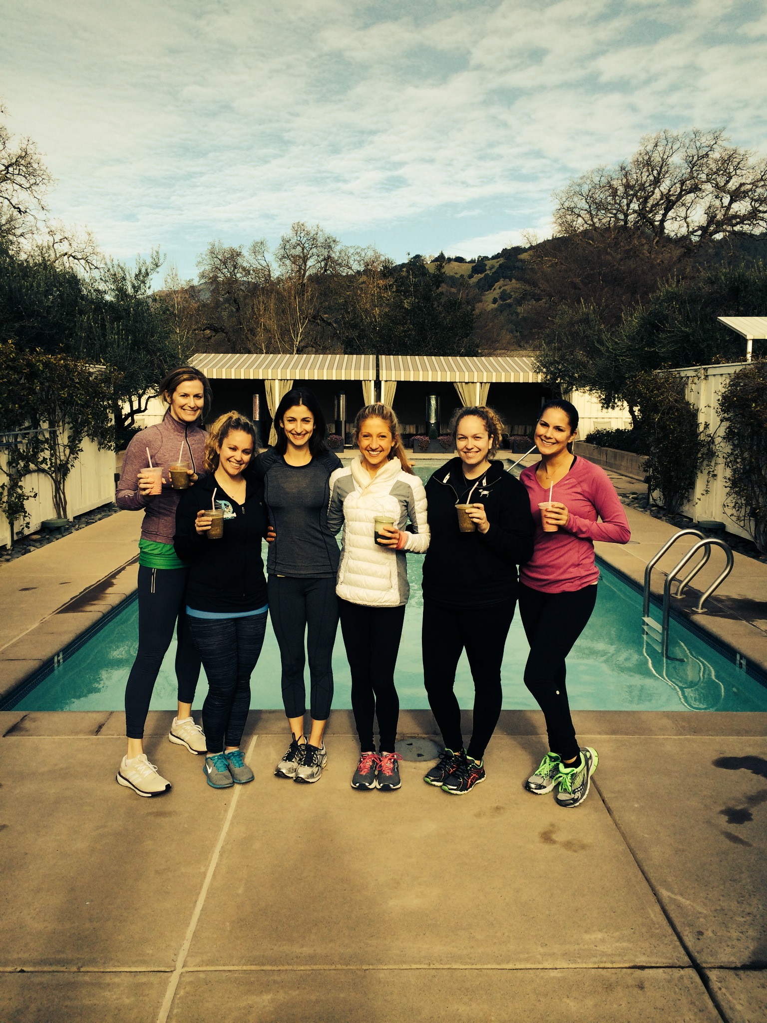 Enjoying post workout healthy smoothies beside one of the geothermal mineral baths at Solage Resort.